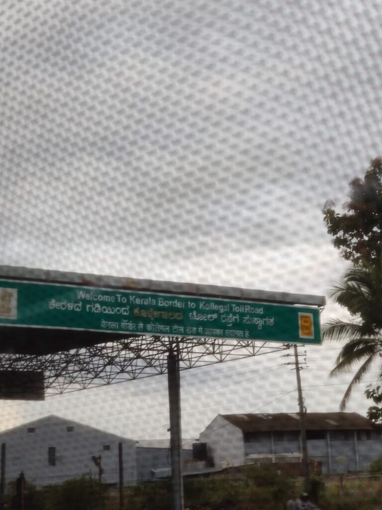 Kerala border entry sign during Bangalore to Wayanad road trip route
