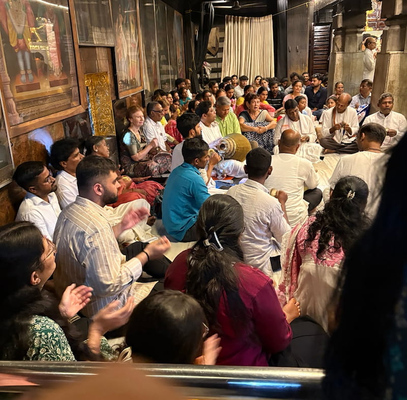 Devotees inside Udupi Krishna temple bhajan scene